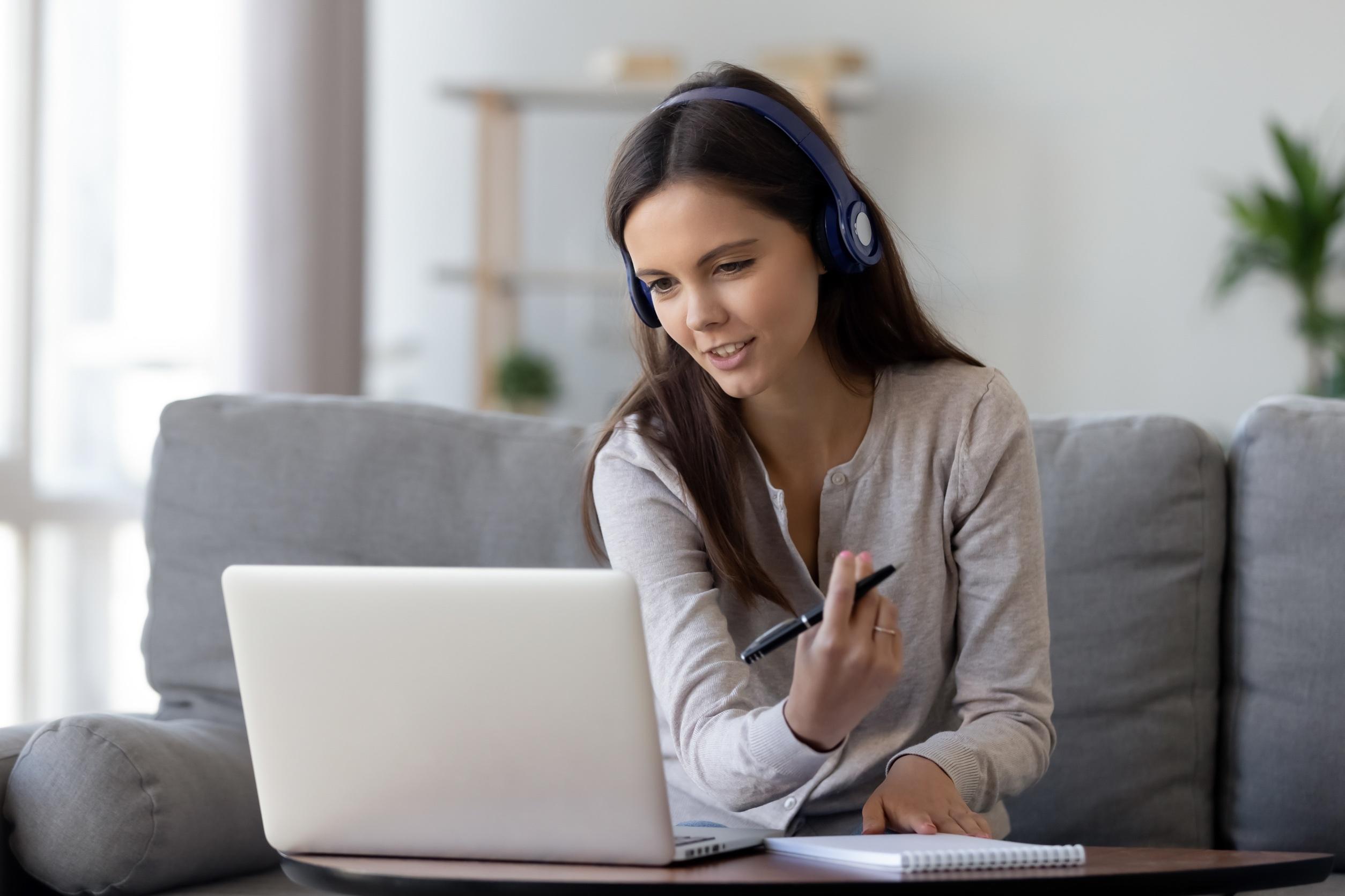 Woman at home looking at a laptop